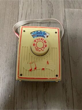 Fisher-Price Cream and Red Portable Turn-Knob Music Toy